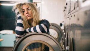 woman next to washing machine