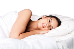 woman sleeping with comforter