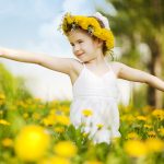 child in a flower field