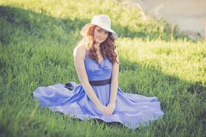 woman in cotton dress on grass