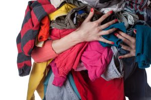 woman holding dirty laundry