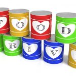 Nine stacked tin cans in different colors charity concept