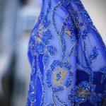 Blue woman beautiful dress fabric closeup