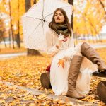 Woman with umbrella in Autumn